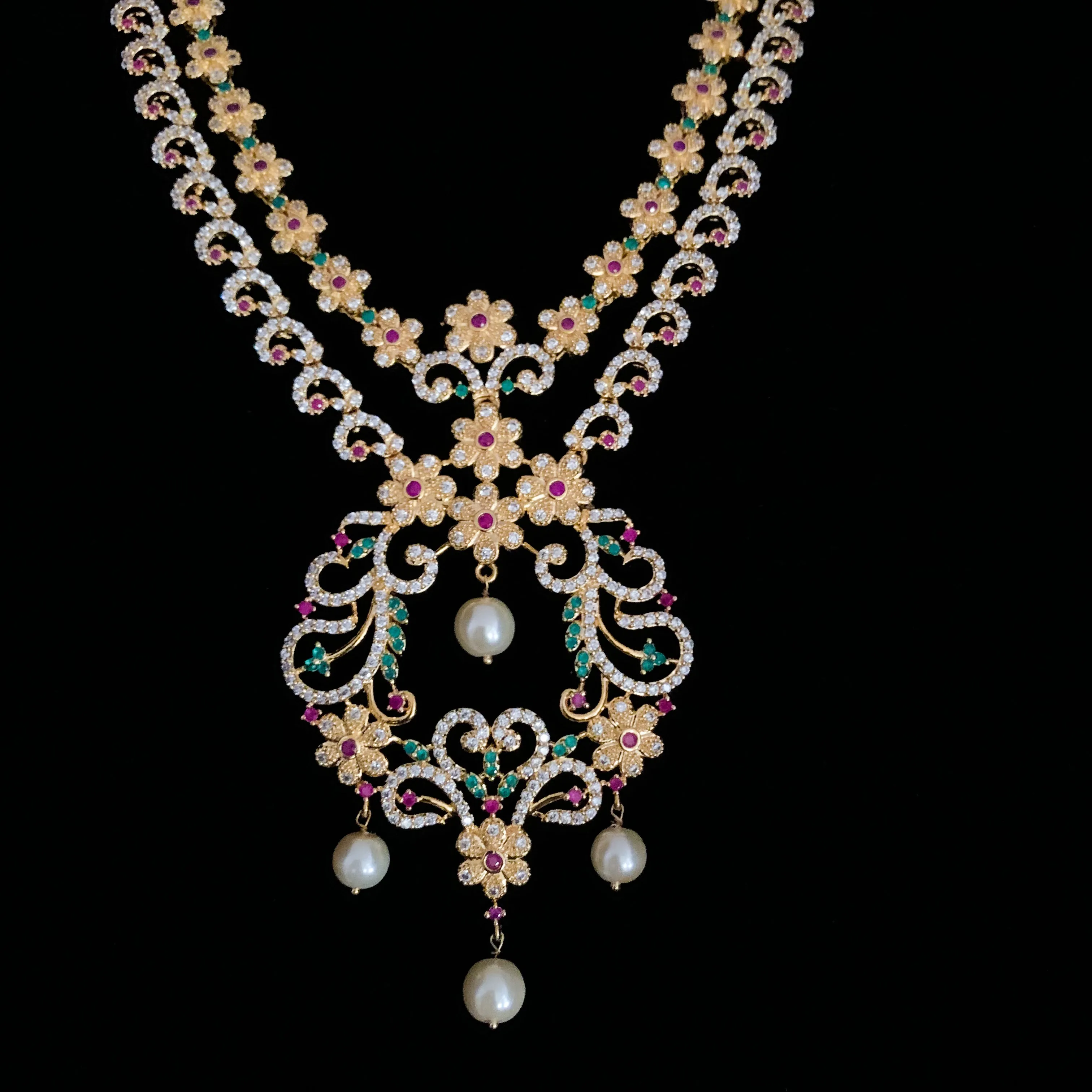 Exquisite Two-layer Long Zircon (CZ) Necklace set with white, red, and green stones.